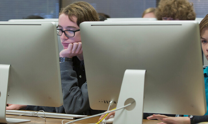 Students using computers in school