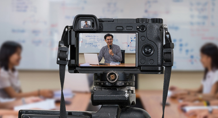 Teacher using AV camera in a classroom with students