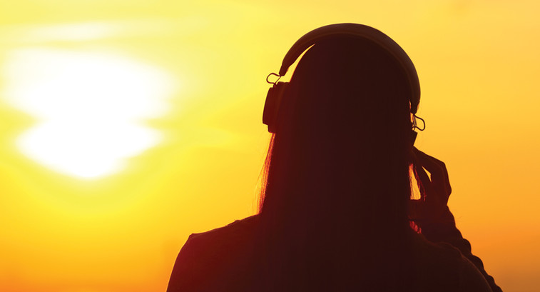 student using headphones silhouette