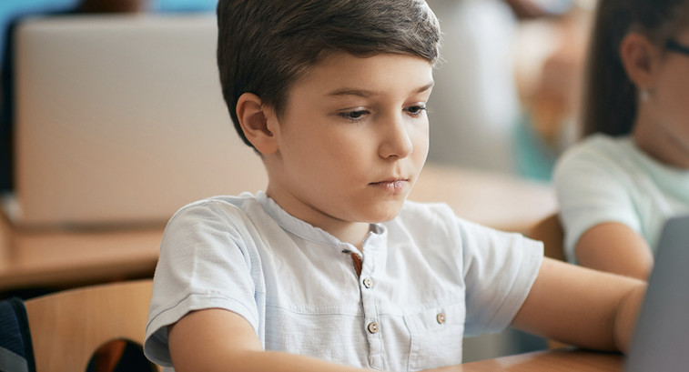 Elementary student using laptop