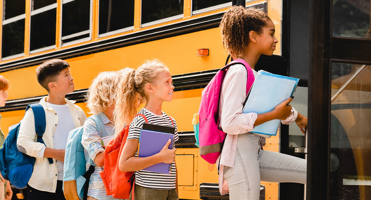 Kids boarding a school bus