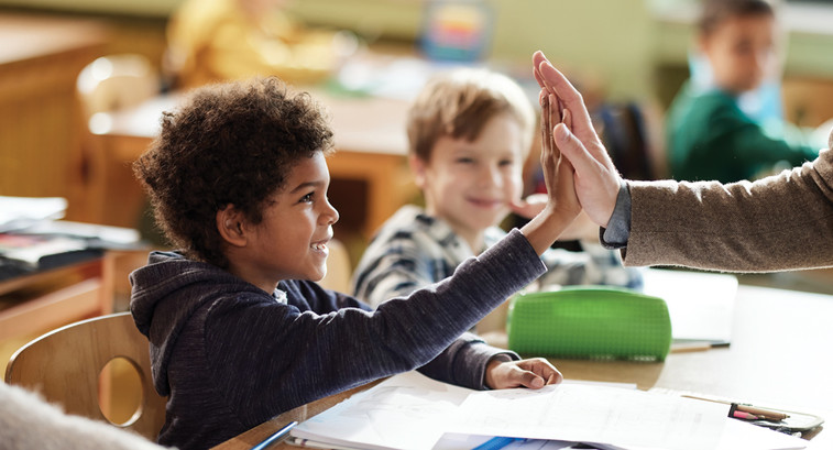 School kids excited in class