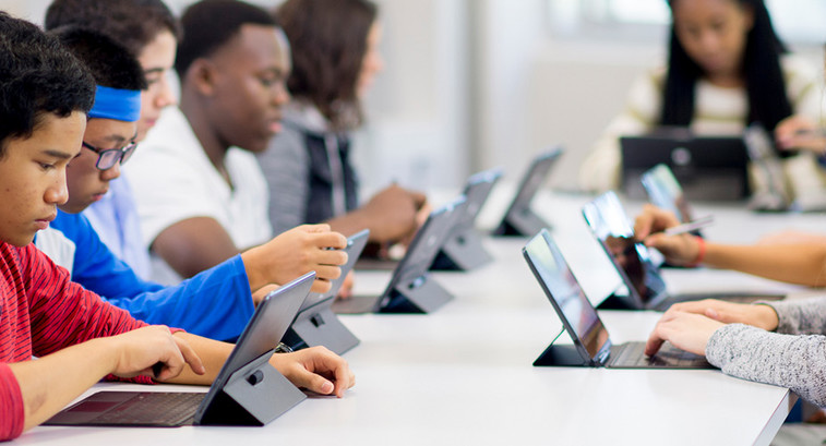 Students working on tablets in classroom