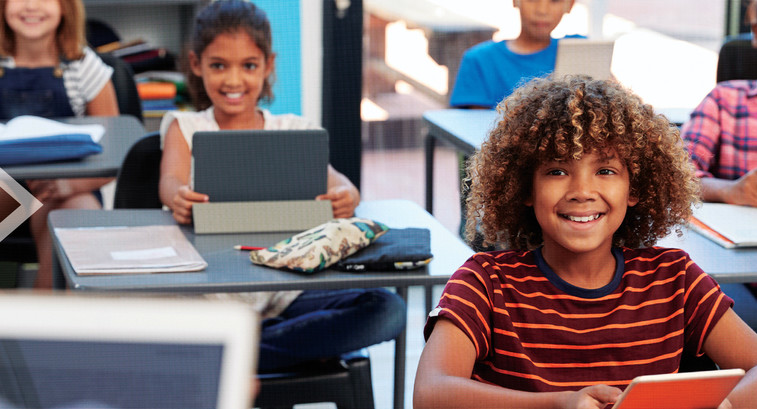 Students using tech in the classroom