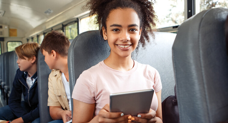 Student using tech on the bus