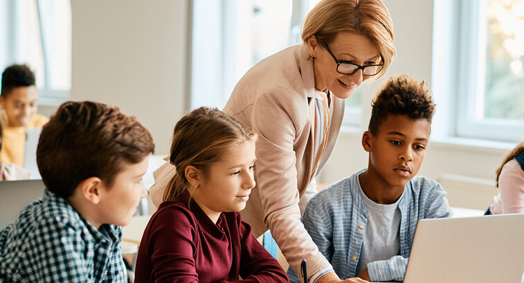 Teacher with students in classroom