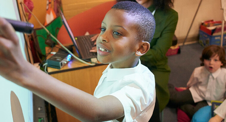 Student using interactive whiteboard