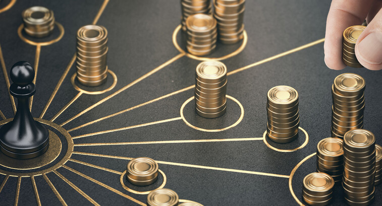 Chess piece surrounded by stacks of gold coins