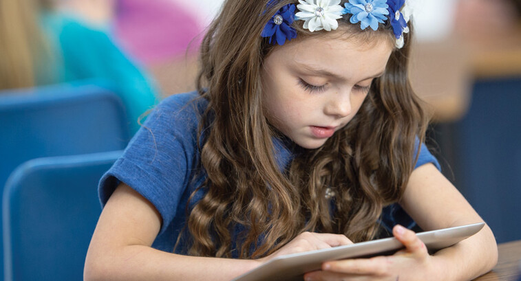 Student using tablet in class