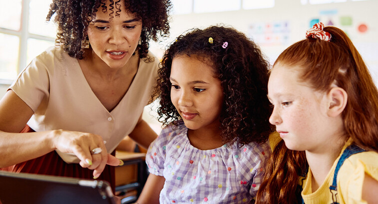 School teacher helping students