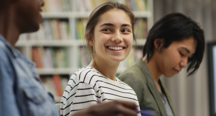 Students talking in the library
