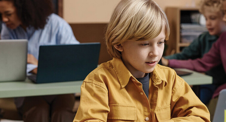 Boy on Laptop in classroom