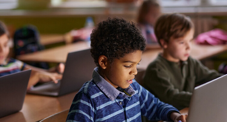Students using computers in classroom