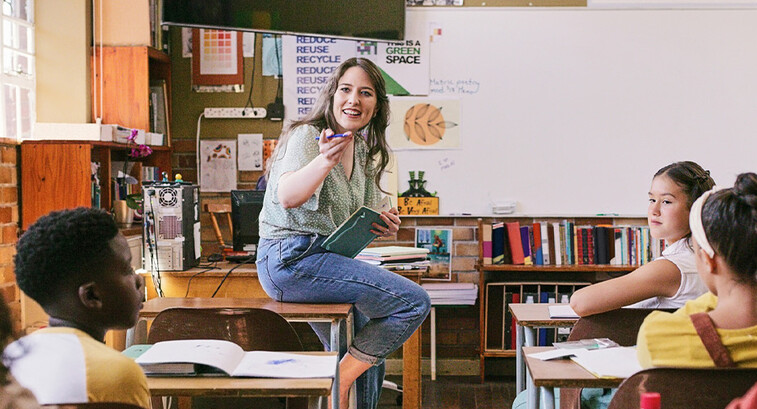 Teacher lecturing students in class