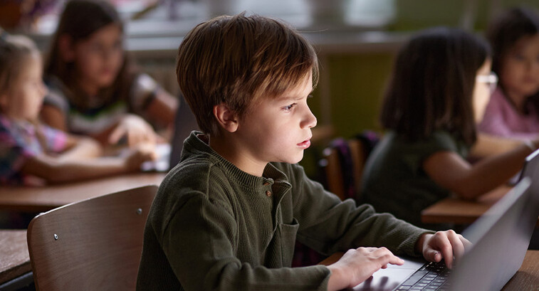 Students using computers in class