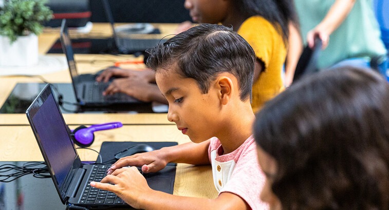 Students using tech in classroom