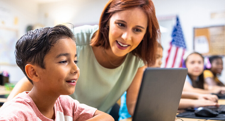 Teacher helping student 