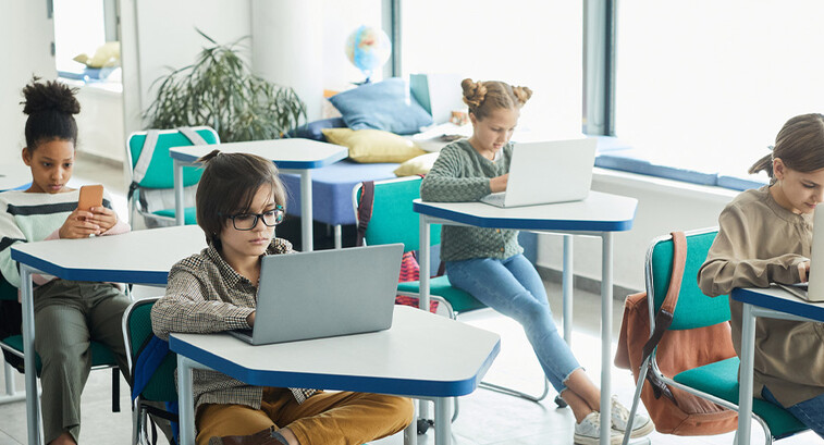 Students using devices in classroom