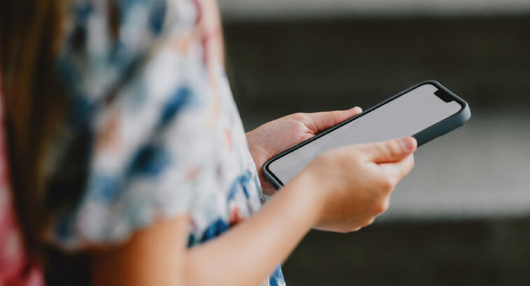 Young student using phone