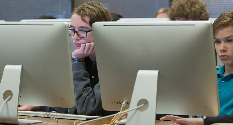 Students using computers in school