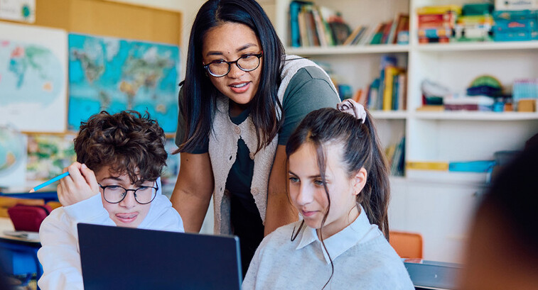 Students using computer in classroom