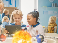 K–12 students observe augmented reality model of solar system
