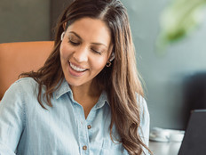 IT woman in leadership role working on laptop