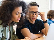 Students working in groups on computers - gamification in K–12