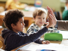 School kids excited in class