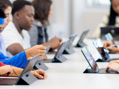 Students working on tablets in classroom