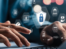 IT admin setting up internet safety policies and monitoring, represented by floating security icons
