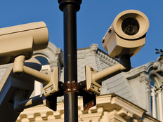 Security cameras installed on pole in front of historic building