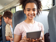 Student using tech on the bus