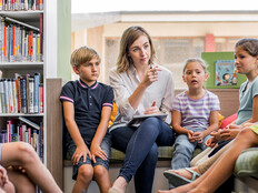 Teacher holding class in the library