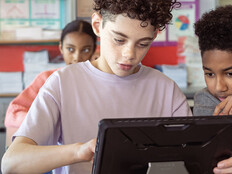 Kids working on group assignment during class