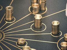 Chess piece surrounded by stacks of gold coins