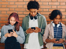 Students looking at phones in school