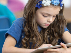 Student using tablet in class