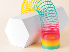 Flexible Multi Colored Coil Striding Hexagon Shape on White Background