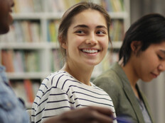 Students talking in the library