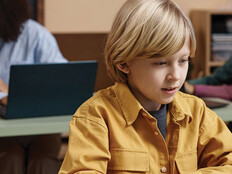 Boy on Laptop in classroom