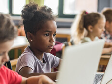 Students using devices in class