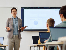 Teacher instructing class with technology