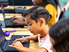 Students using tech in classroom