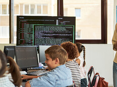 Teacher observing students in a classroom