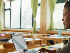Teacher using laptop