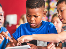 Teacher helping students