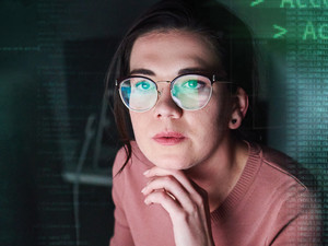 cybersecurity IT woman looking at screen