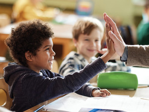 School kids excited in class