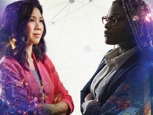 Image shows two women looking at each other with their arms crossed and a cityscape behind them